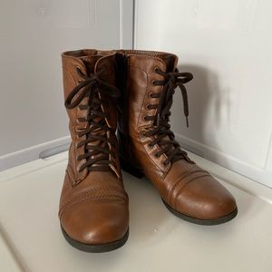Brown combat boots with zippers